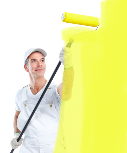 a man using a roller to paint